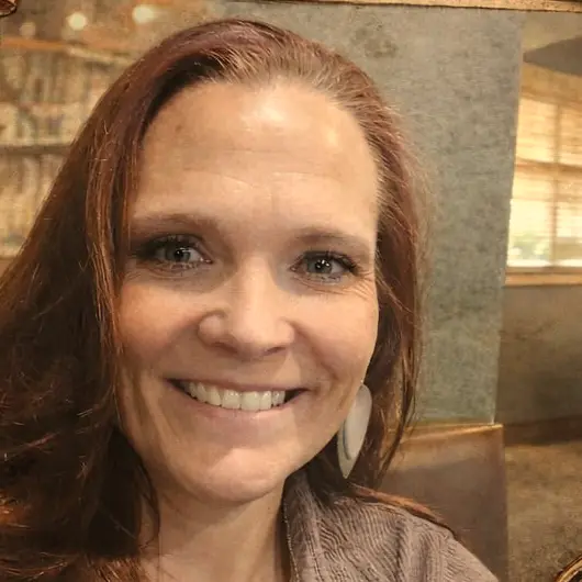 Marie, co-owner of Buried Treasures, smiling