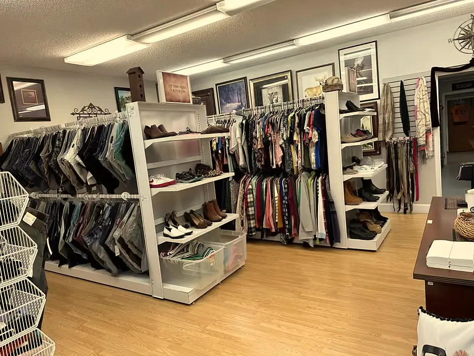 Bright aisles of clothing and shoes on the sales floor